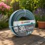 Gardena Classic 30 m garden hose, 13 mm diameter, coiled on lawn in garden setting