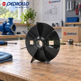 Black electric pump fan impeller with 24 mm shaft bore on workshop bench